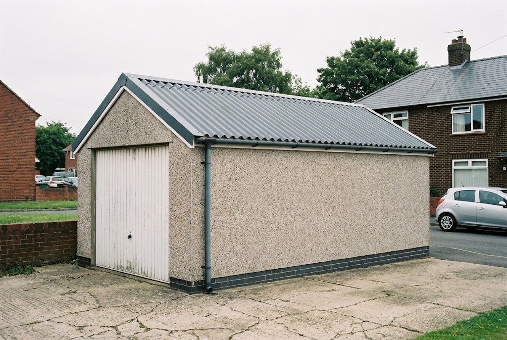 Garage in Dudley with a new dark steel roof after asbestos removal